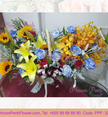 Mixed cut flowers basket of lily, rose & orchid